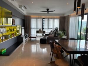 Open-plan living and dining area with yellow-fronted cabinets, a long marble dining table, and a gray sofa facing large windows and a balcony view.