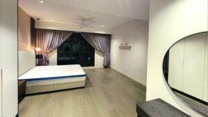Spacious modern bedroom with a double bed, low headboard, and purple curtains framing a large window at the far wall.